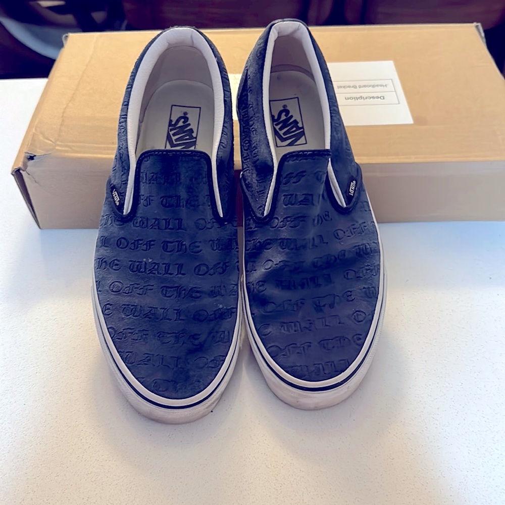 Vans size 11 blue with “Off the Wall” script all over.